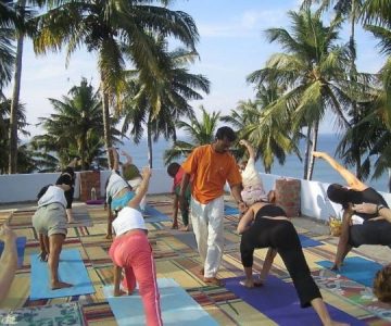 Yoga Teacher instructing a class on a Yoga Tour